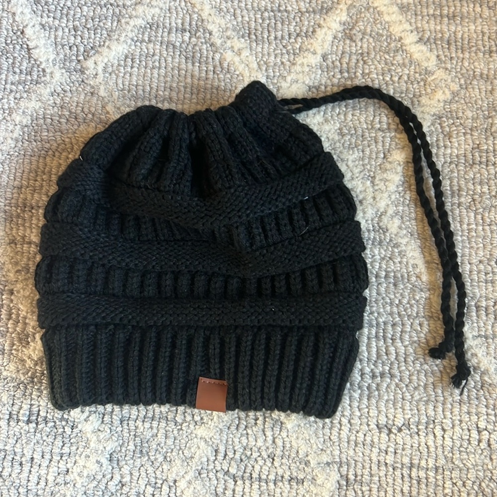 Black hat. With pony tail hole at the top